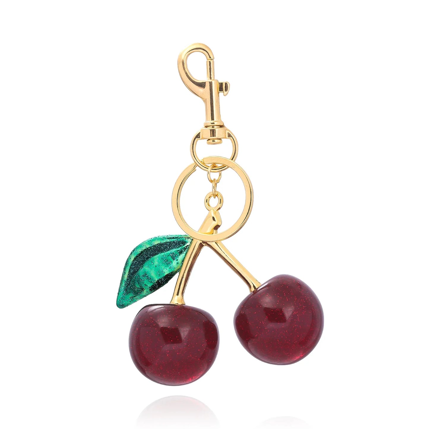 Kersen sleutelhanger dames – glanzend accessoire met gouden details en rode glitterkersen