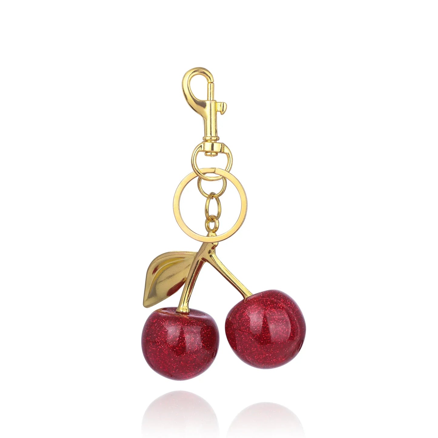 Kersen sleutelhanger dames – glanzend accessoire met gouden details en rode glitterkersen
