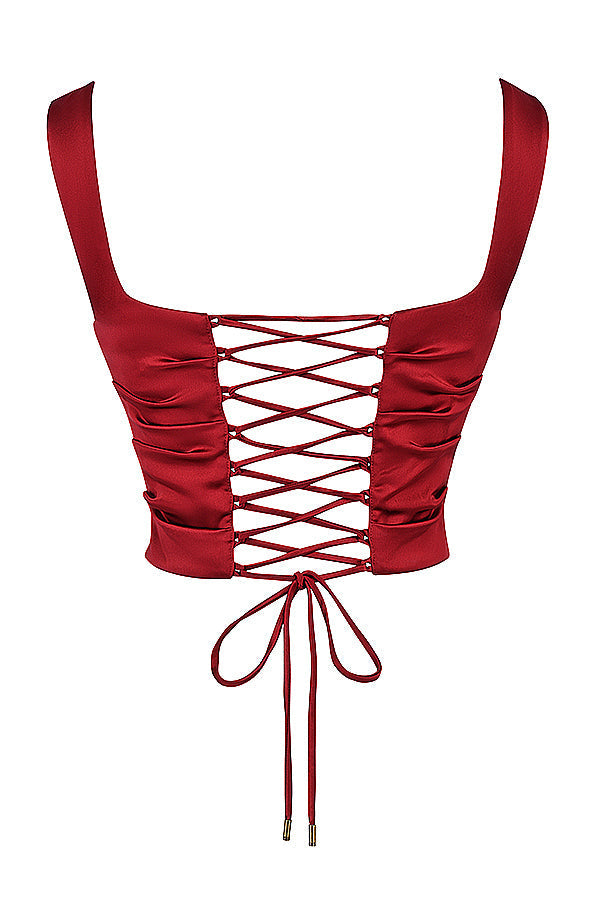 Tweedelige satijnen set met corset-top en schuine maxirok