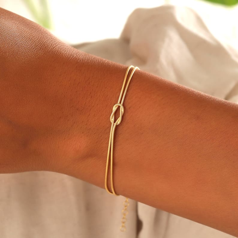 Minimalistische dames armband met knoop – elegant goudkleurig sieraad voor elke gelegenheid
