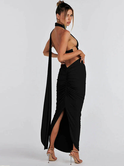 Zwarte asymmetrische crop top en maxi-rok set