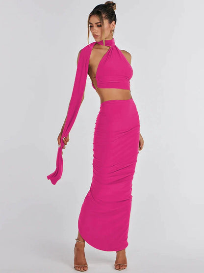 Zwarte asymmetrische crop top en maxi-rok set