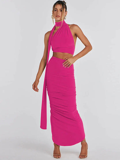 Zwarte asymmetrische crop top en maxi-rok set