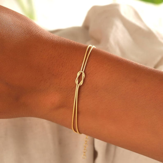 Minimalistische dames armband met knoop – elegant goudkleurig sieraad voor elke gelegenheid